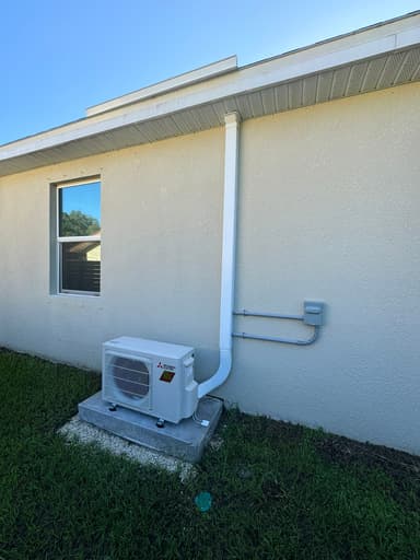 Mitsubishi condensor mini split installed outside professional